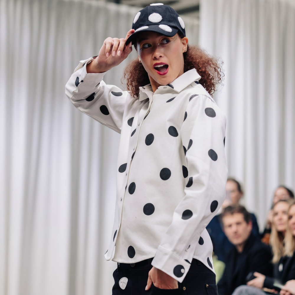 Black structured cap with bold 3D polka dots. Shop premium designer styles online.
