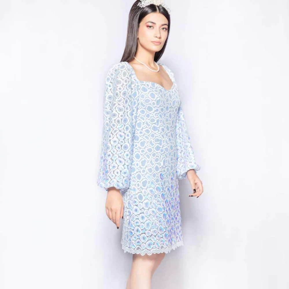The Raindrops dress in ivory blue from our capsule collection cut from imported embroidered and scalloped lace.