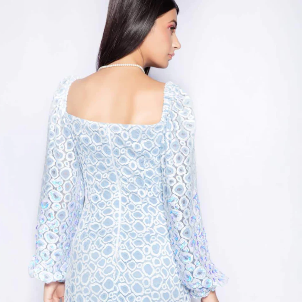 The Raindrops dress in ivory blue from our capsule collection cut from imported embroidered and scalloped lace.