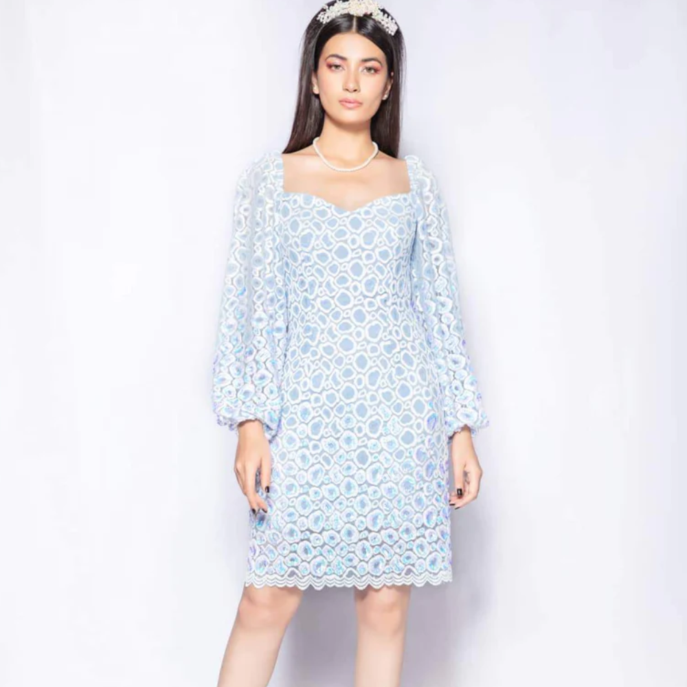 The Raindrops dress in ivory blue from our capsule collection cut from imported embroidered and scalloped lace.