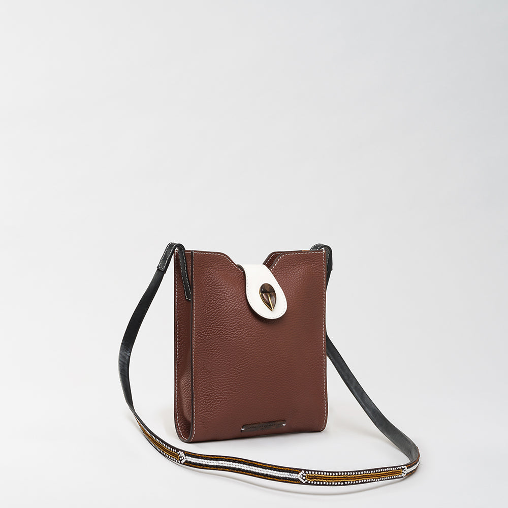 Experience The Luxe Maison's Raph Nala Brown, crafted for luxe accessory lovers online. This timeless piece adds elegance to your wardrobe. Shop Now!