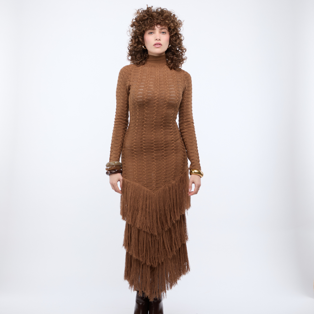 Shop this Brown Knit Maxi Dress at TLM, featuring long sleeves, sheer texture and waist cut-outs. Explore luxury fashion on The Luxe Maison website.