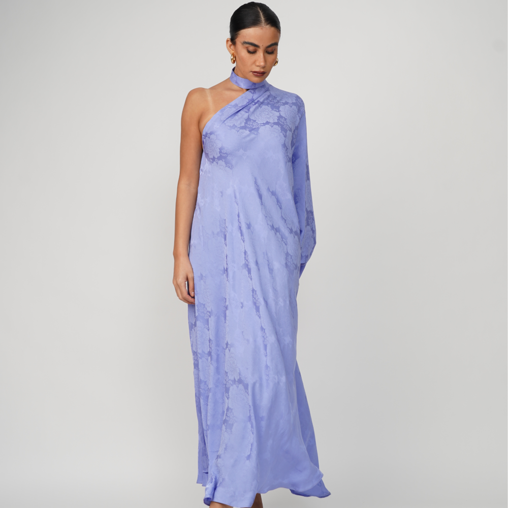 Silky maxi gown with one-shoulder single draped extra-long sleeve with flared hem.