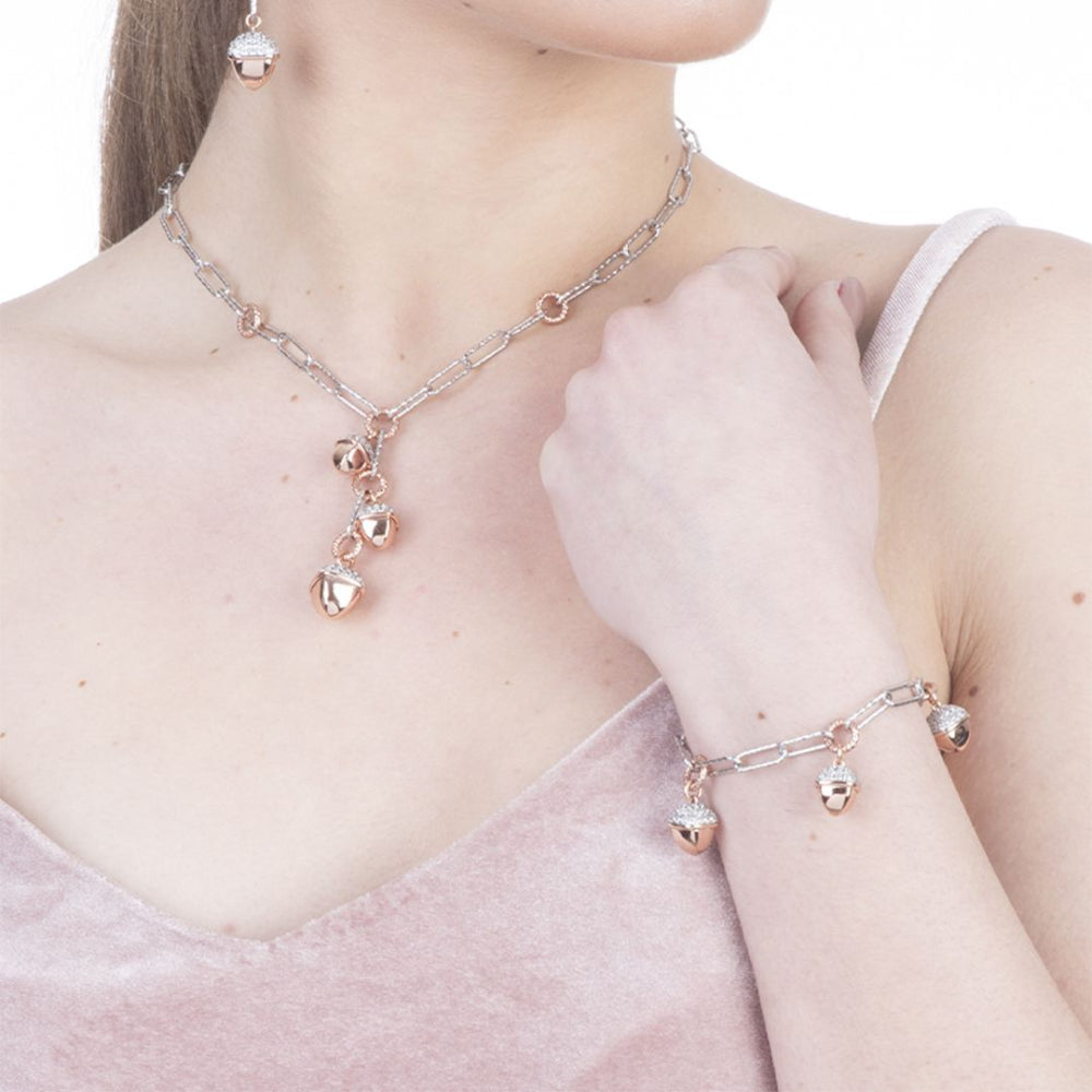 Shop online premium rhodium and rose gold plated necklace with pyramid pendants and sparkling cubic zirconia accents.