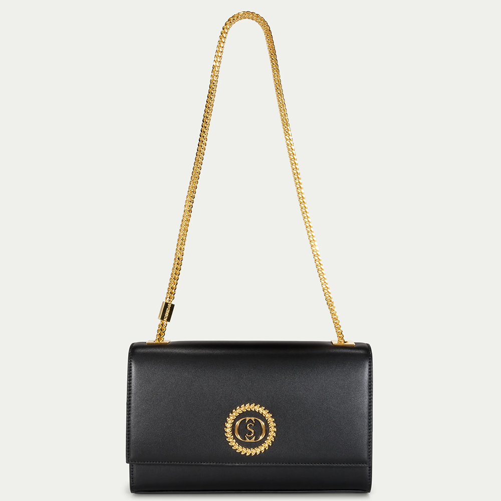 This velvet bag is hand-finished in Italy with gold plated hardware.