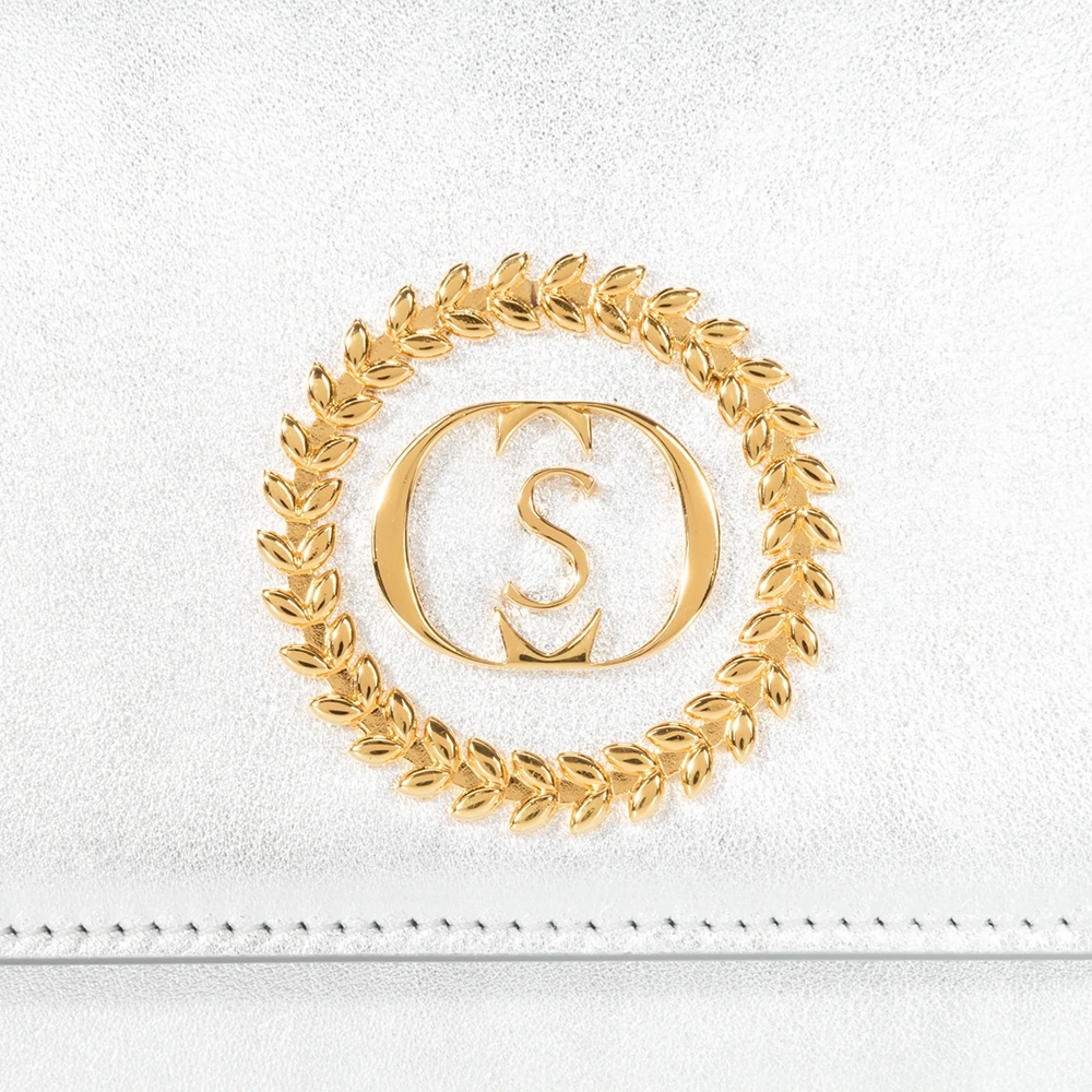 This velvet bag is hand-finished in Italy with gold plated hardware.