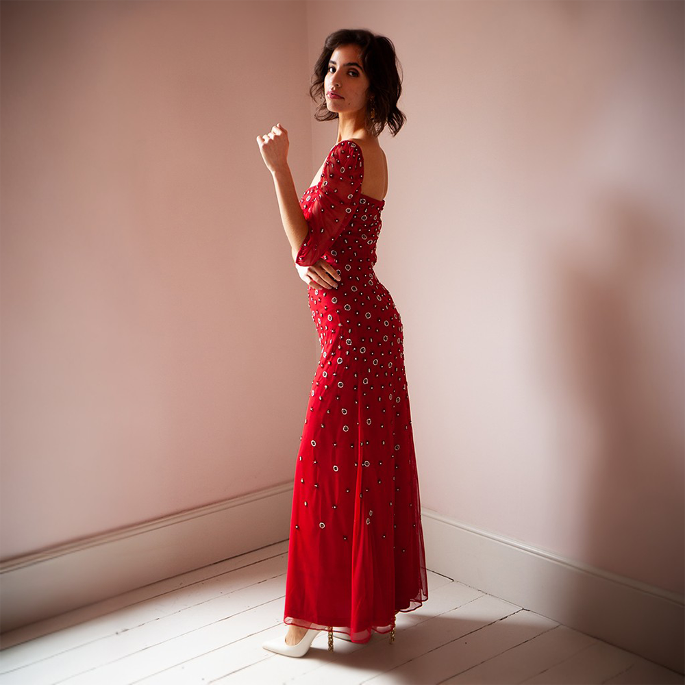 The Zanab Gown features delicate beading with three-quarter sleeves and a sweetheart neckline.