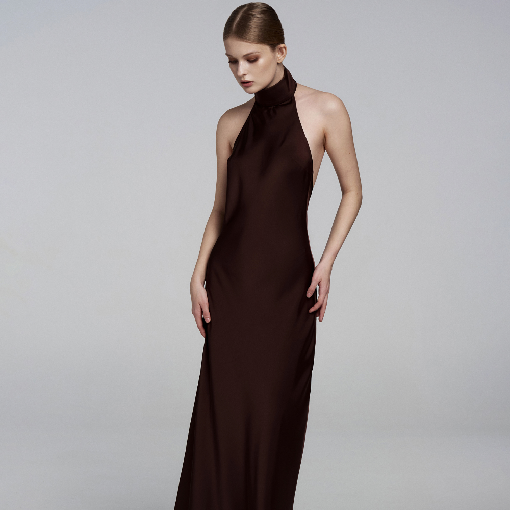 Elegant floor-length dress with a stunning open back for a graceful, timeless look. Shop now at our exclusive clothing website.