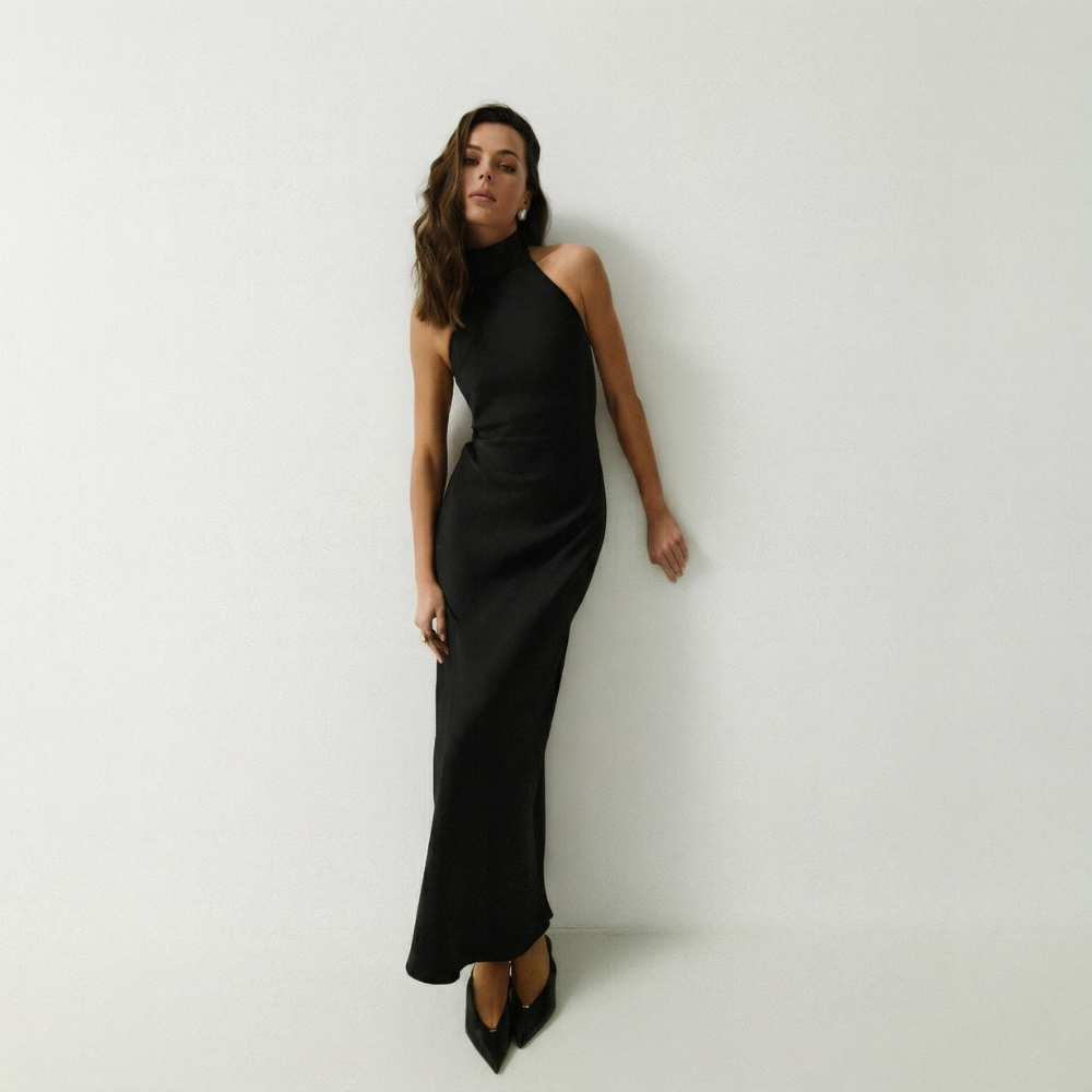Elegant floor-length dress with a stunning open back for a graceful, timeless look. Shop now at our exclusive clothing website.