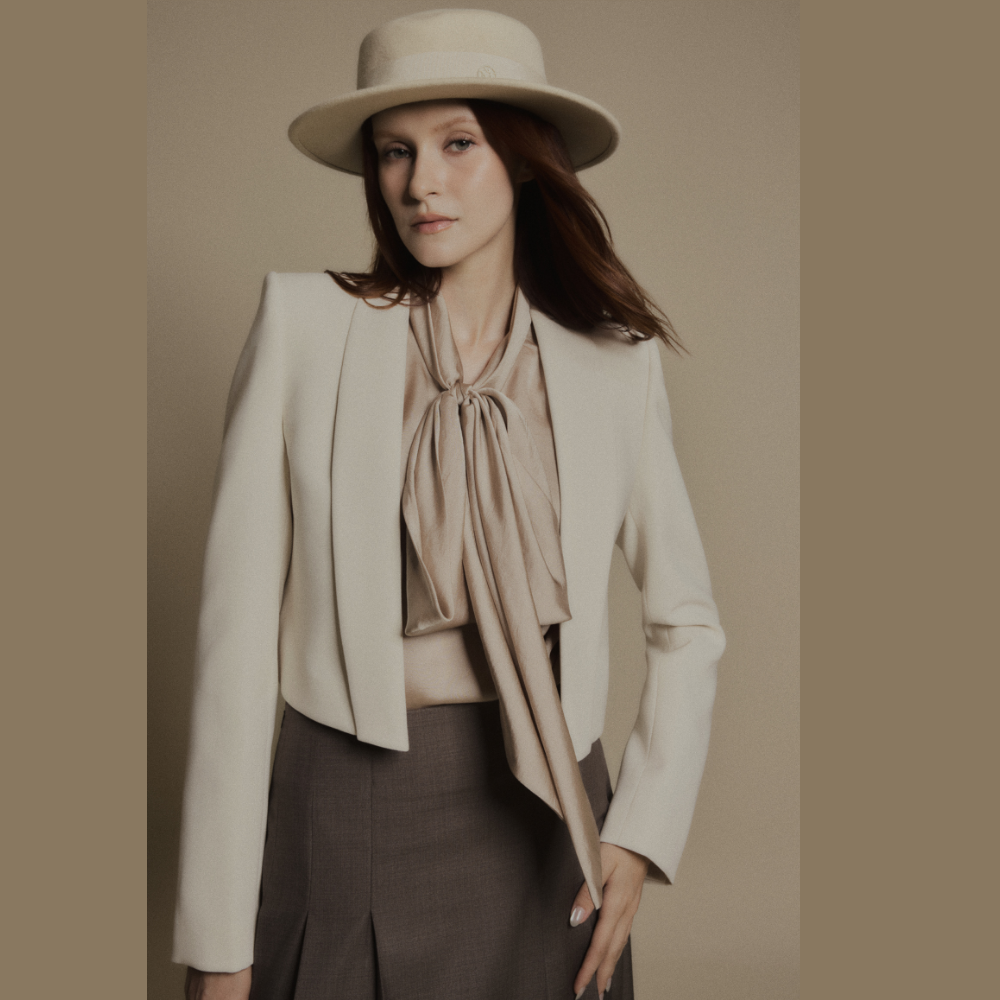 Create sophisticated looks by combining luxury dresses with the elegant Sandstone Cropped Blazer. Shop Now!