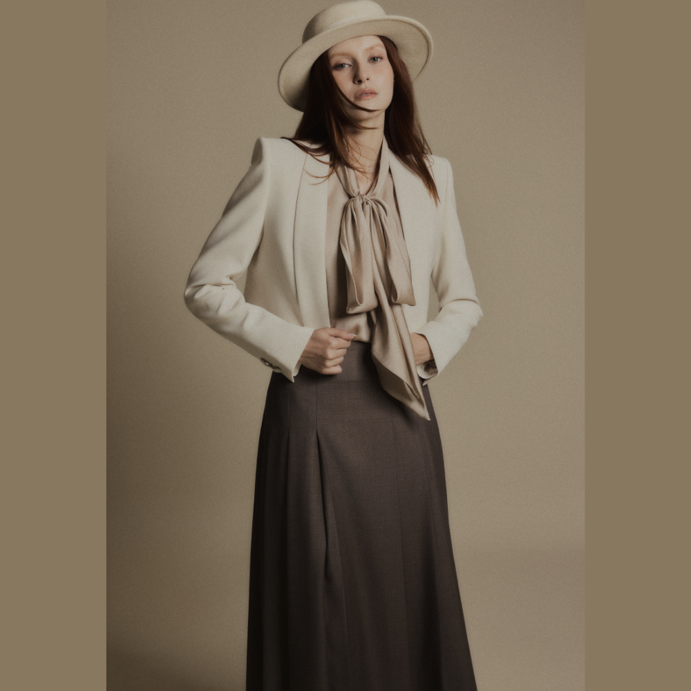 Create sophisticated looks by combining luxury dresses with the elegant Sandstone Cropped Blazer. Shop Now!