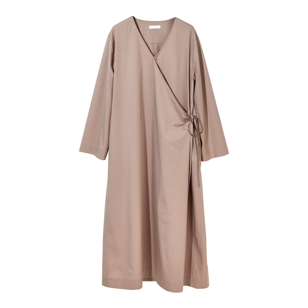 Discover the Sarita Caftan at The Luxe Maison, featuring an ankle-length wrap design, wide sleeves, adjustable side ties, and a V-neckline for effortless elegance.