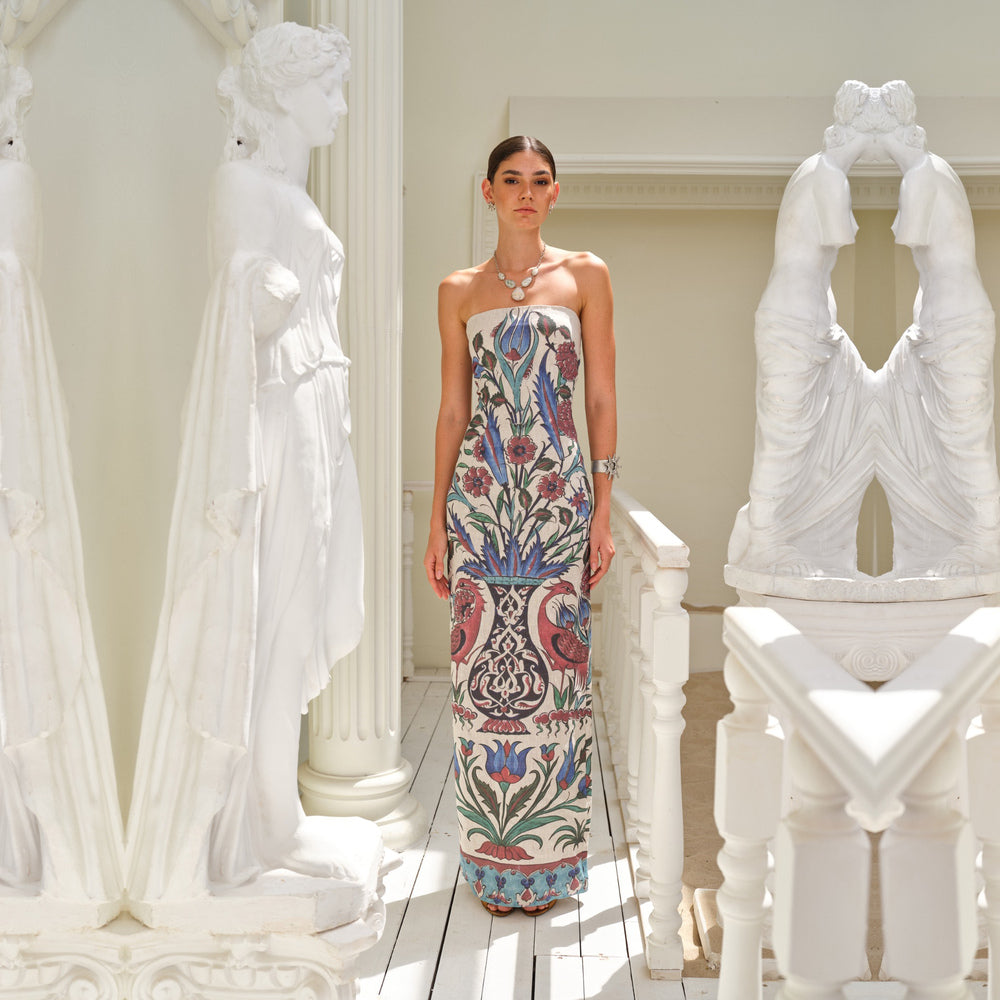 Shop online from our exclusive website and discover the Sarnic Dress by Nana Gotti, a strapless 100% linen dress with Ottoman-inspired prints and a timeless elegant silhouette.