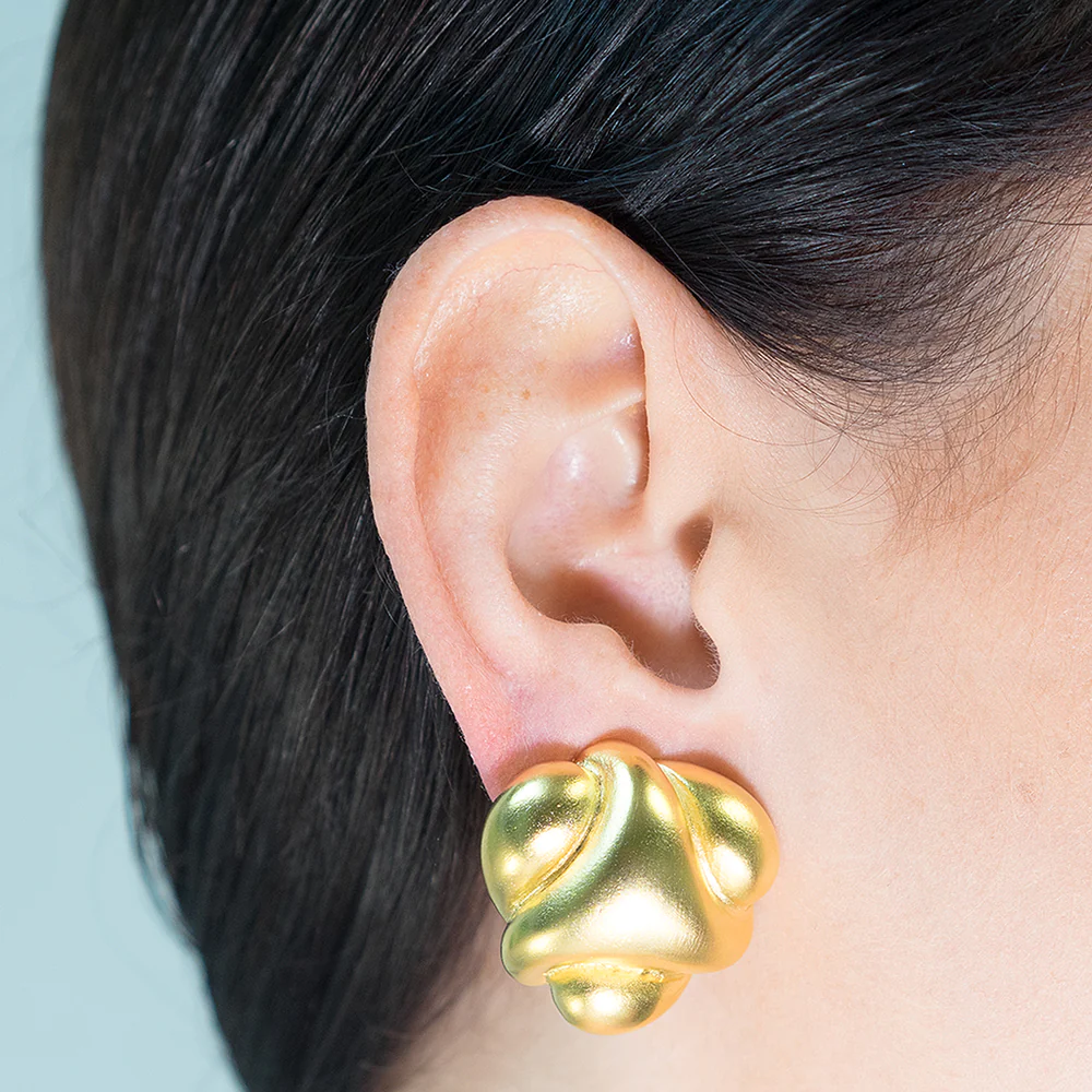 Step up your gold collection with these abstract satin gold button earrings. 1" diameter