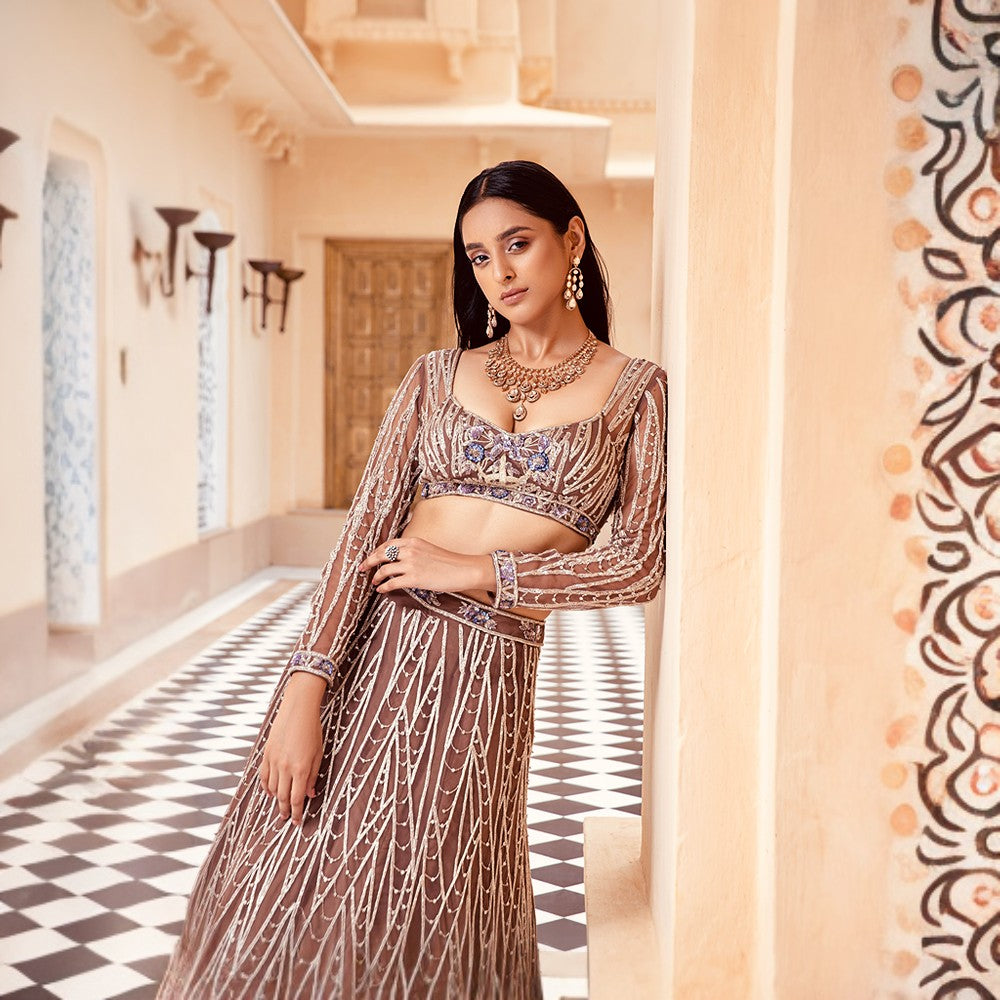 Scintilla rings of the cosmos juxtaposed with bouquet of flowers over blouse and lehenga.