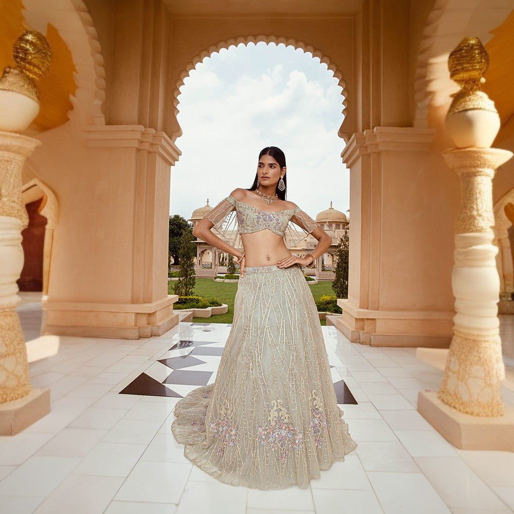 Scintilla rings of the cosmos juxtaposed with bouquet of flowers over blouse and lehenga.