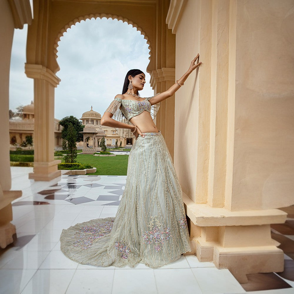 Scintilla rings of the cosmos juxtaposed with bouquet of flowers over blouse and lehenga.