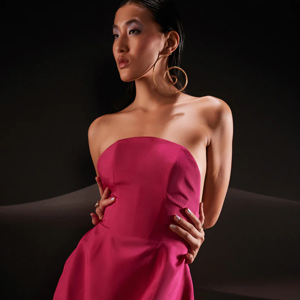 Embody an unapologetic spirit of celebration in this sculptural sleeveless taffeta dress in hot pink.