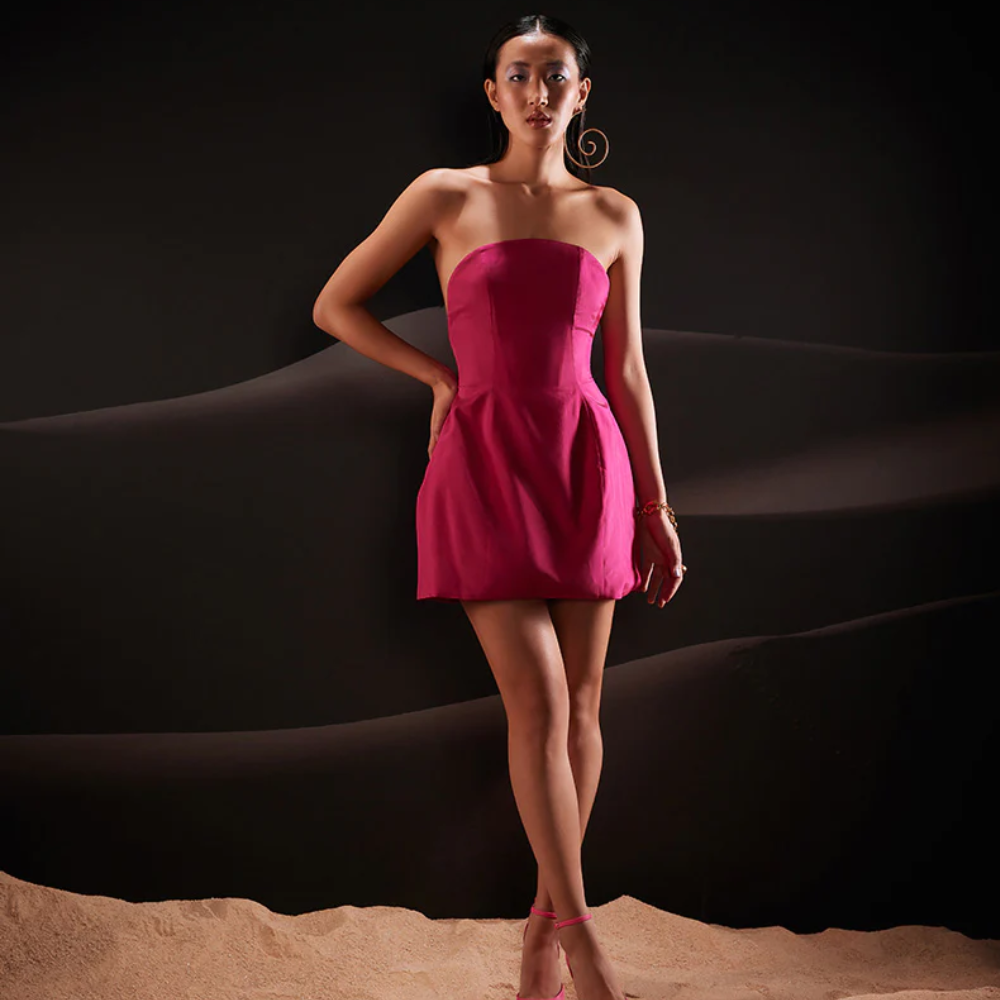 Embody an unapologetic spirit of celebration in this sculptural sleeveless taffeta dress in hot pink.