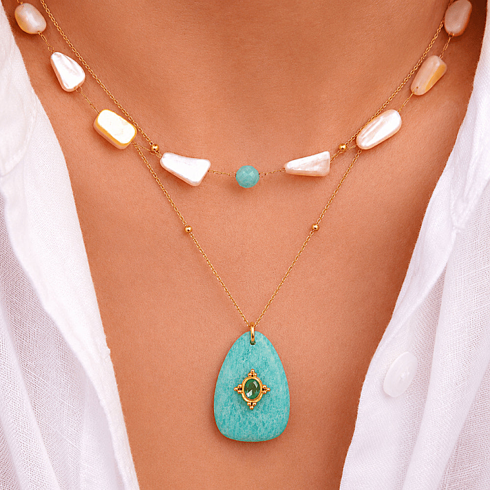 Discover the Seabreeze Shell & Amazonite Necklace at The Luxe Maison, featuring natural yellow shell, ocean-blue amazonite, and a 14K gold-plated chain for a fresh, effortless summer look.