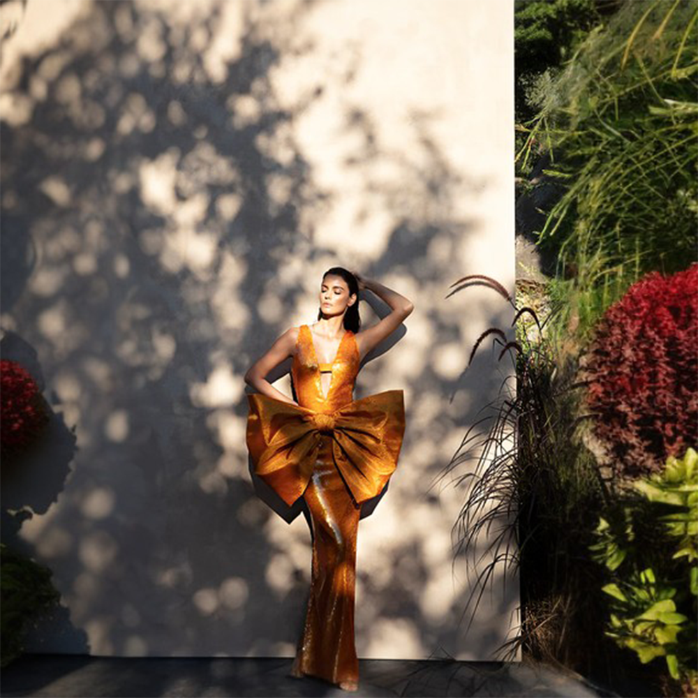 Orange sequins dress in taffeta oversized bow.