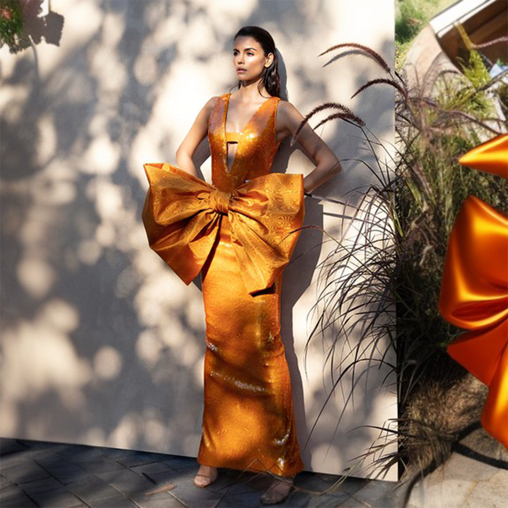 Orange sequins dress in taffeta oversized bow.