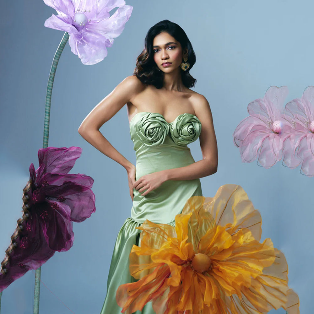 Pastel green strapless gown with fitted bodice and flowy skirt, perfect for events. Shop online from our curated edit of premium fashion.