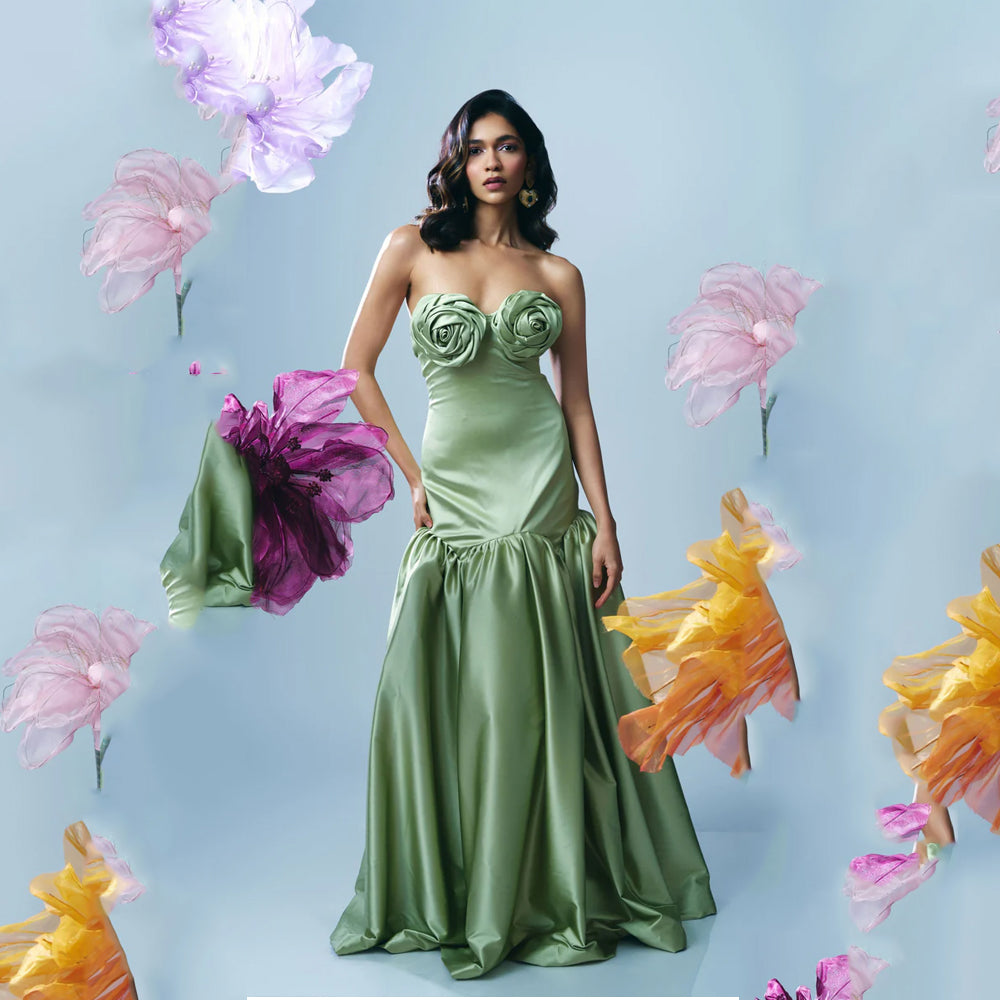Pastel green strapless gown with fitted bodice and flowy skirt, perfect for events. Shop online from our curated edit of premium fashion.