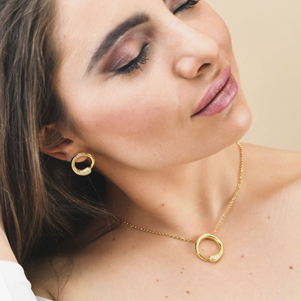 Shop online premium rose gold plated drop earrings with concentric circle design, sky blue stone and sparkling cubic zirconia accents for elegant styling.