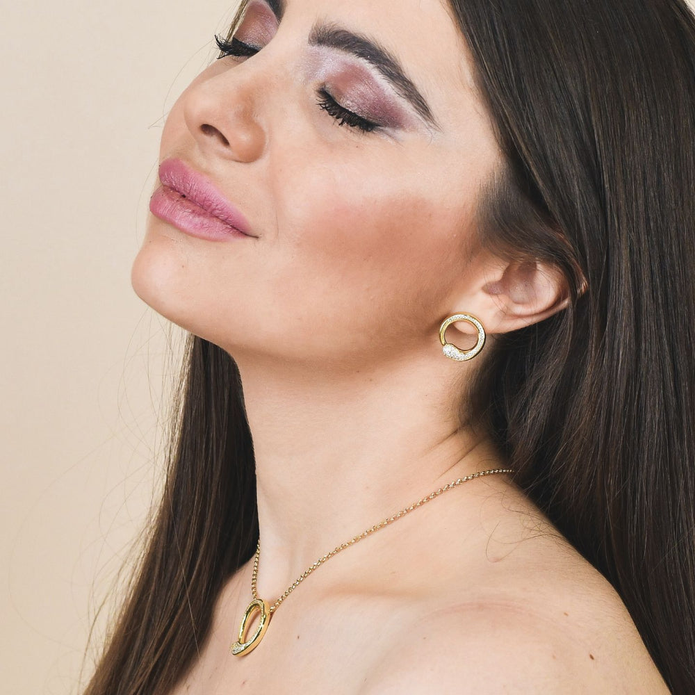 Shop online premium rose gold plated drop earrings with concentric circle design, sky blue stone and sparkling cubic zirconia accents for elegant styling.