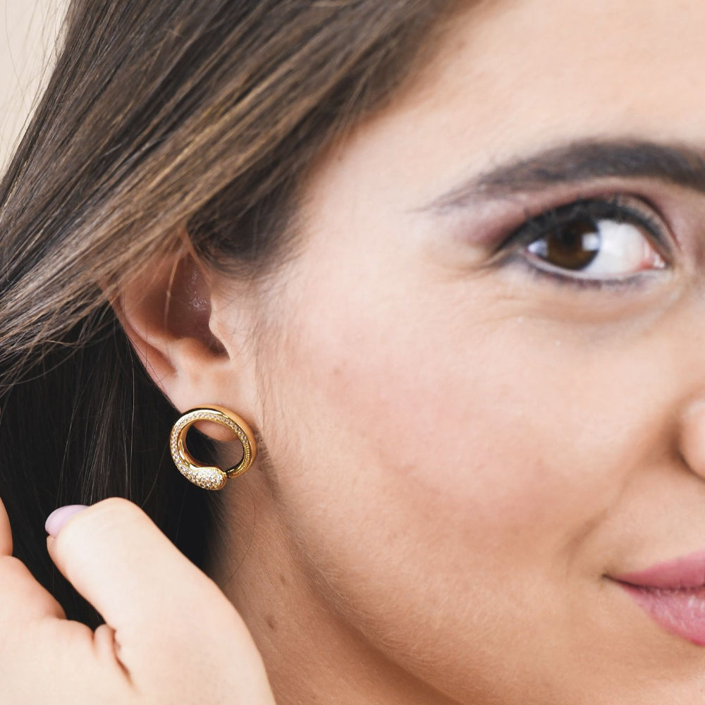 Shop online premium rose gold plated drop earrings with concentric circle design, sky blue stone and sparkling cubic zirconia accents for elegant styling.