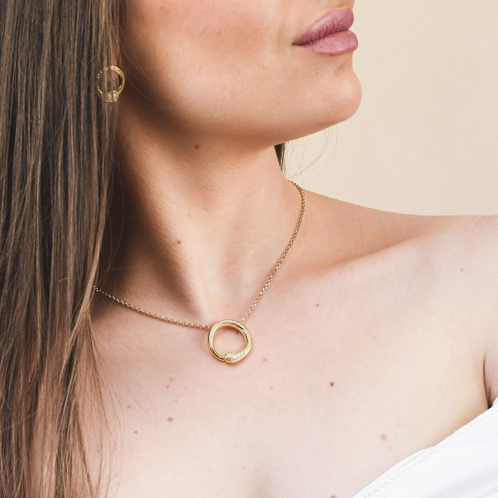 Shop online premium yellow gold pendant necklace with sparkling pave cubic zirconia circle design.