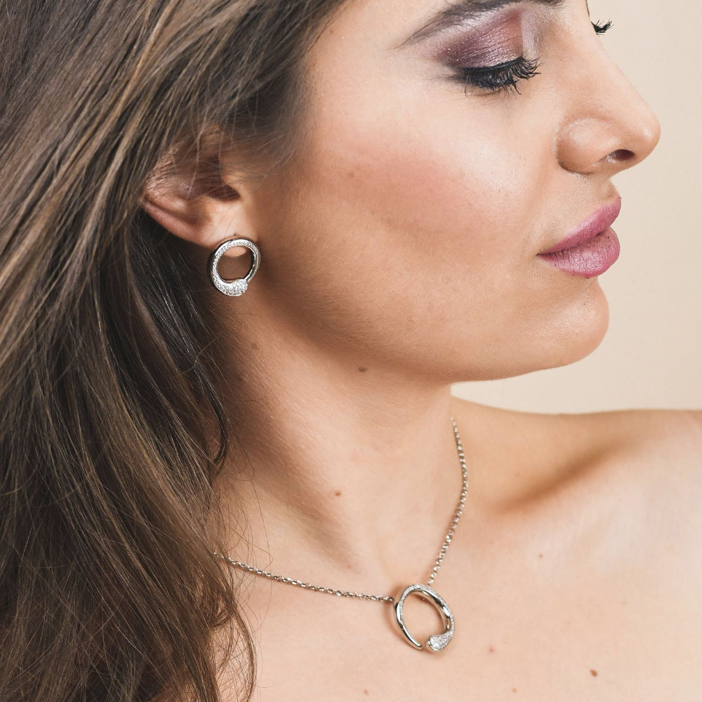 Shop online premium rhodium plated wrap earrings with drop-shaped pavé cubic zirconia detailing for elegant modern styling.