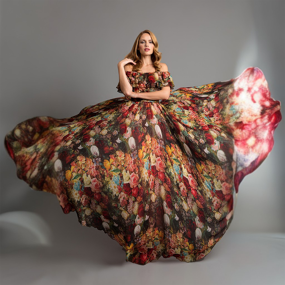 This silk maxi dress is romanced with florals. Off shoulder and playfully detailed with a ruffle trim.