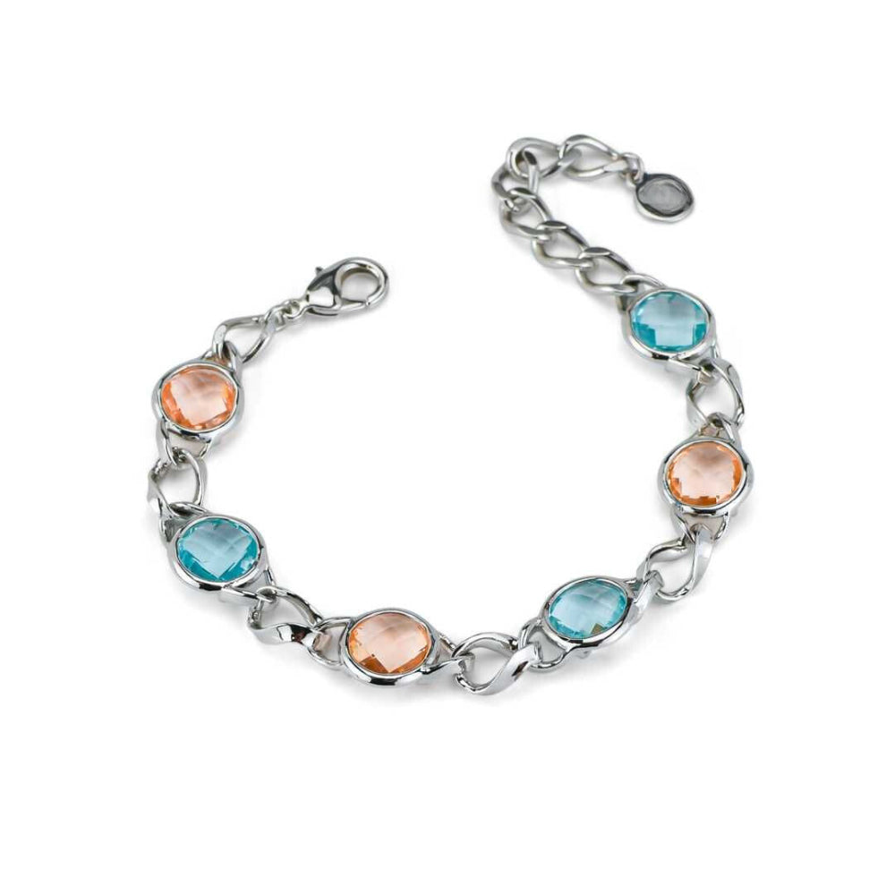 Elegant rhodium plated bronze bracelet with alternating aquamarine and peach double-tone crystals for a modern luxe look. Shop premium jewelry online.