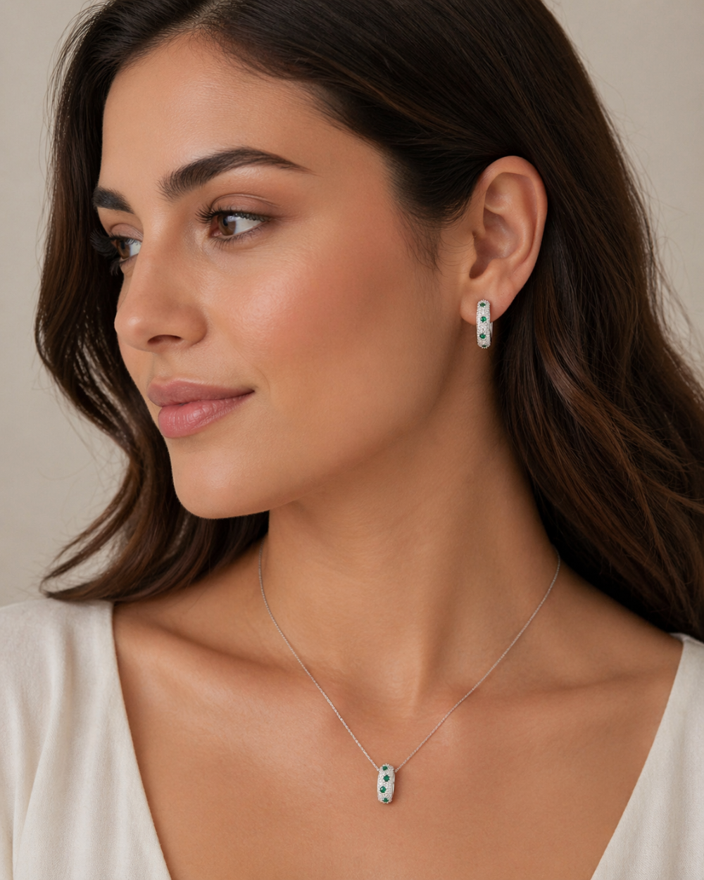 Shop online premium sterling silver emerald speckled necklace with oval pavé ring of created emeralds and white cubic zircons.