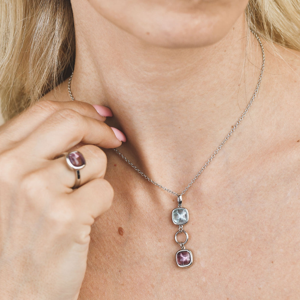 Shop online premium rhodium plated necklace with purple amethyst and aquamarine crystals with circular module accents.