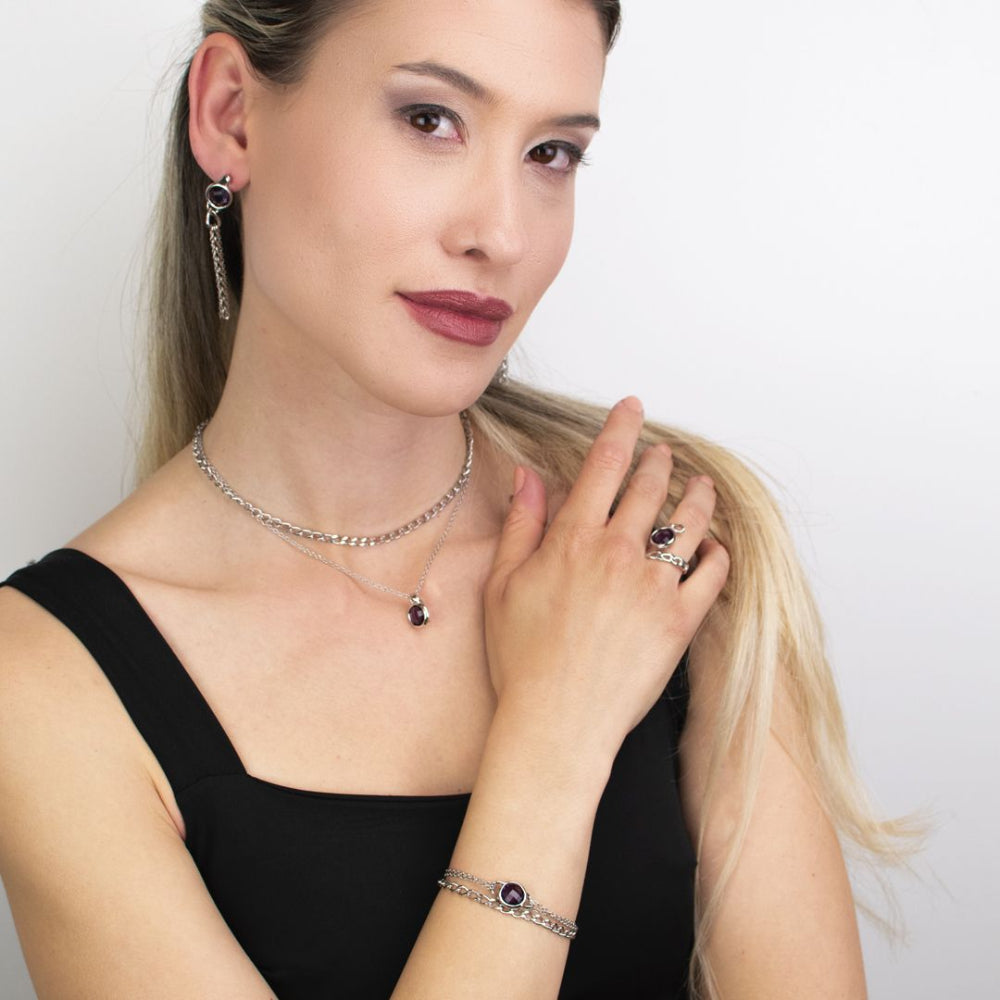 Elegant rose gold plated bracelet with concentric circle detailing, sparkling cubic zirconia, and a sky blue crystal accent. Perfect for luxe everyday styling. Shop premium jewelry online.
