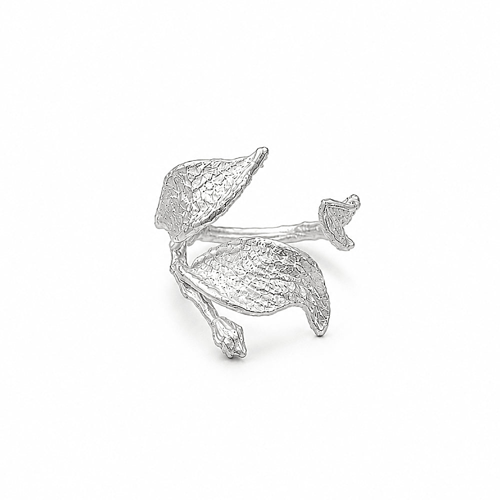 Discover the Silver Wind Leaf Sterling Silver Ring at The Luxe Maison, featuring delicately sculpted leaves and a tiny bud in a nature-inspired design. Crafted in textured S925 sterling silver with an adjustable open band, this elegant ring captures the beauty of leaves in motion and adds an organic, graceful touch to everyday style.
