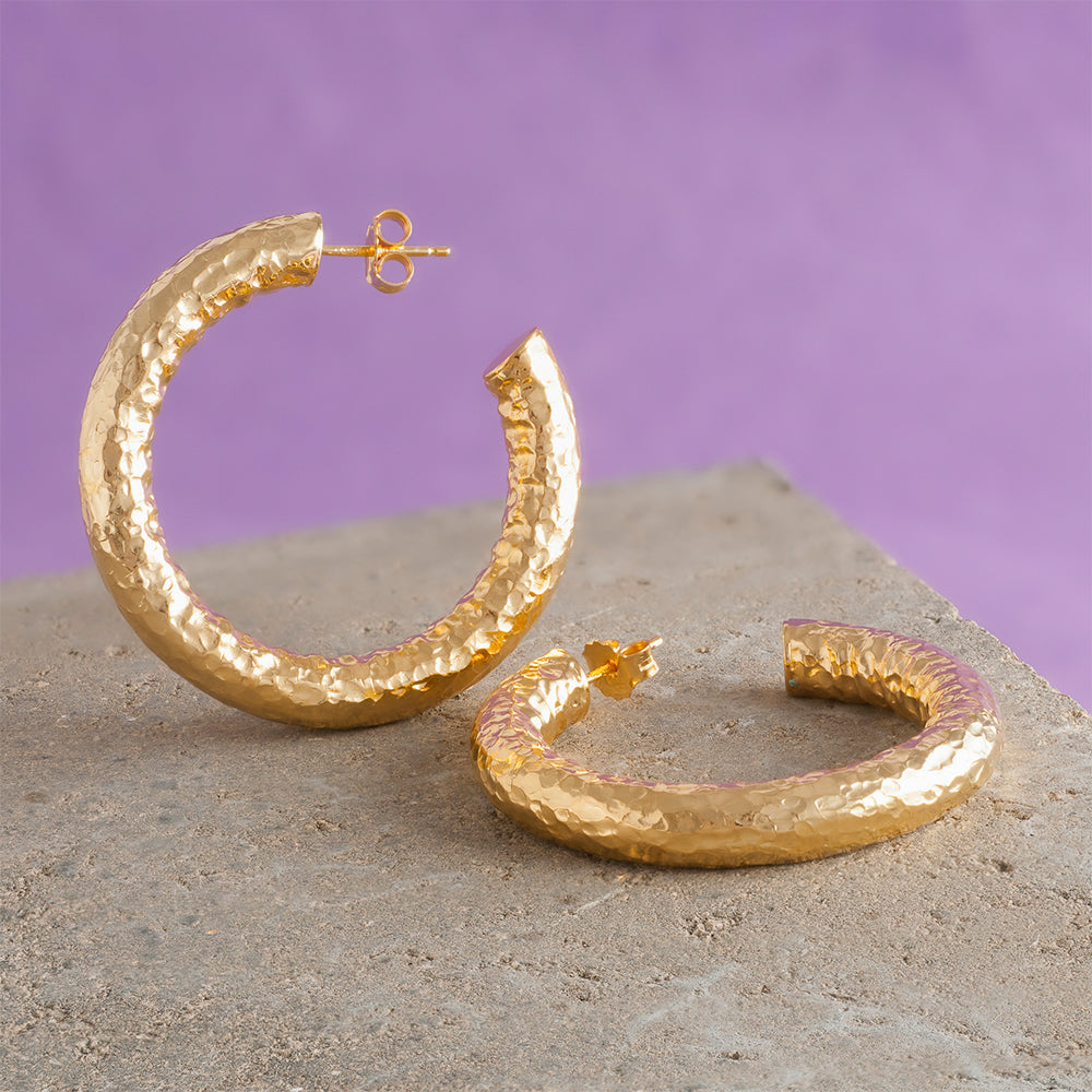 Add a touch of elegance to your look with our small gold hammered hoop earrings. Perfect to shop women's accessories! Shop Now!