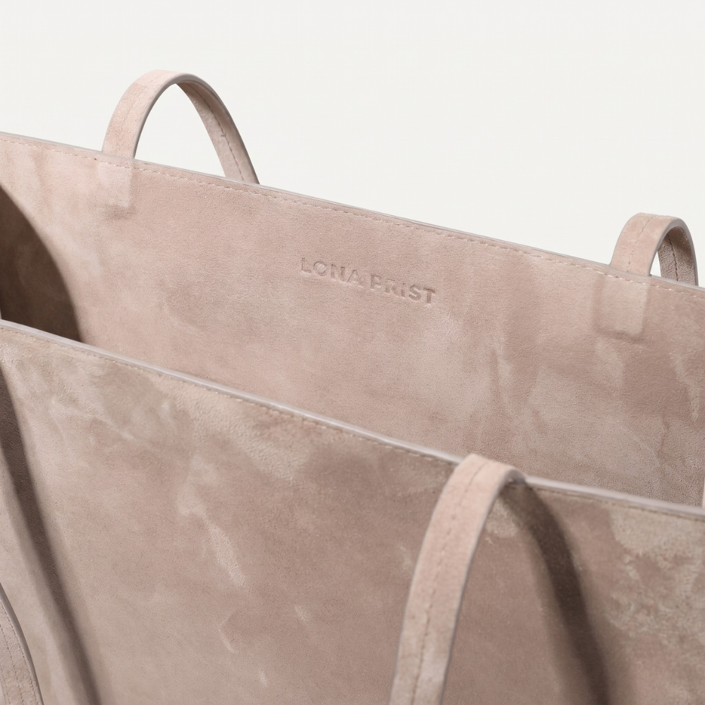 Small suede tote bag with soft lining and shoulder carry, perfect for daily use. Shop online from our curated edit of premium fashion.