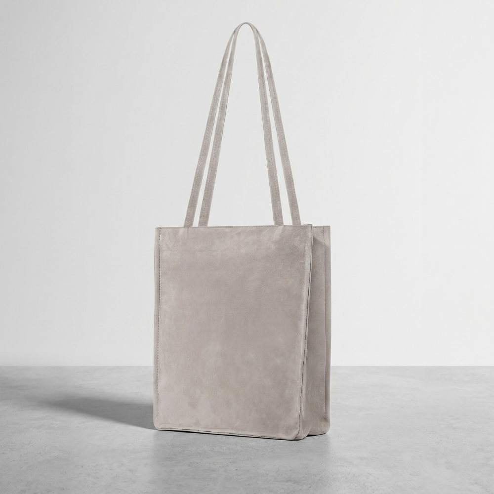 Compact suede tote bag with soft lining, ideal for daily essentials. Shop online from our curated edit of premium fashion.