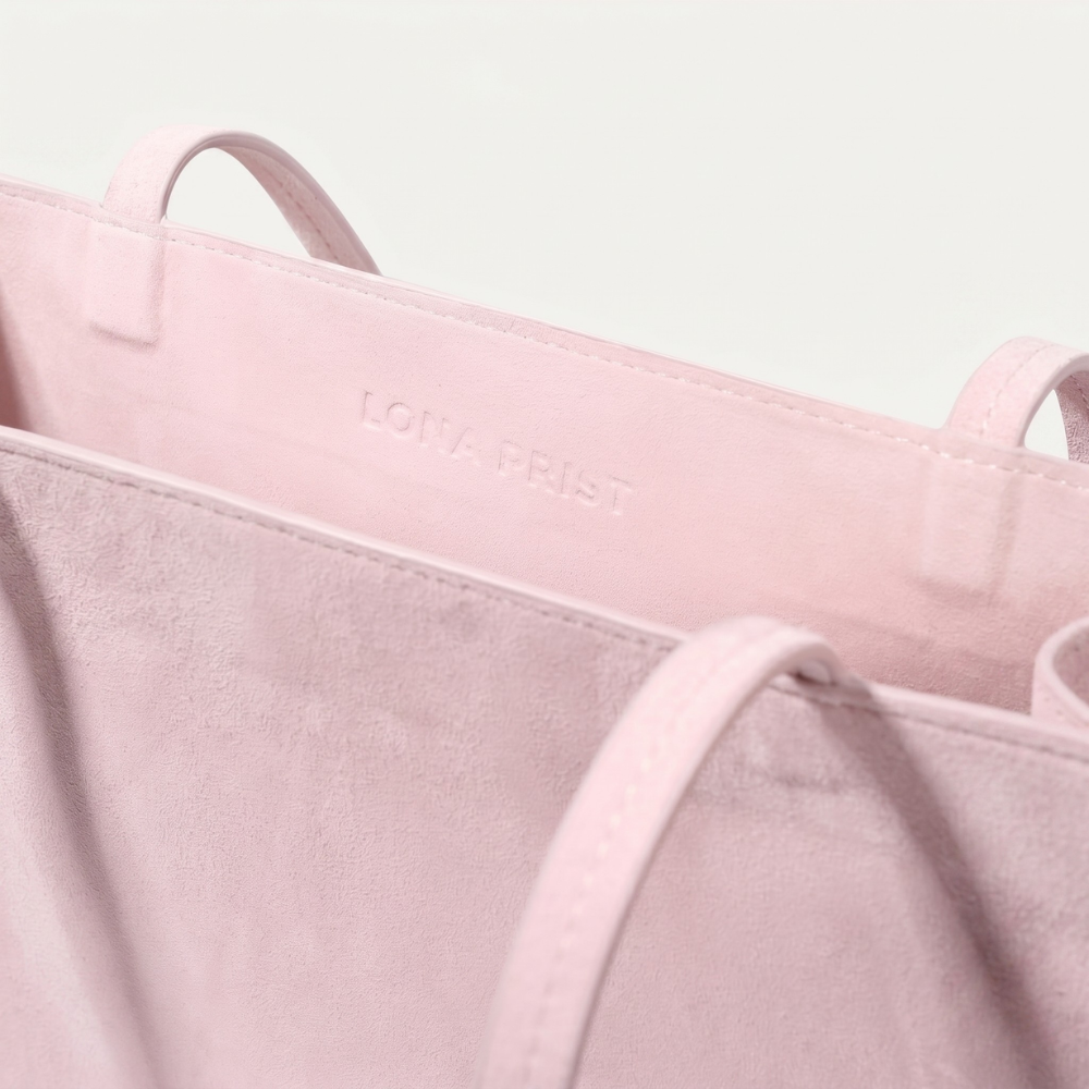 Genuine suede tote bag with soft lining and shoulder carry design. Shop online from our curated edit of premium fashion.