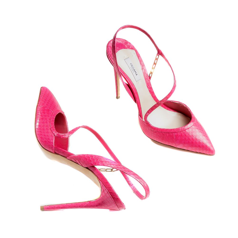 An elegant mid-heel pump in fuchsia watersnake designed to instantly elevate your look. 