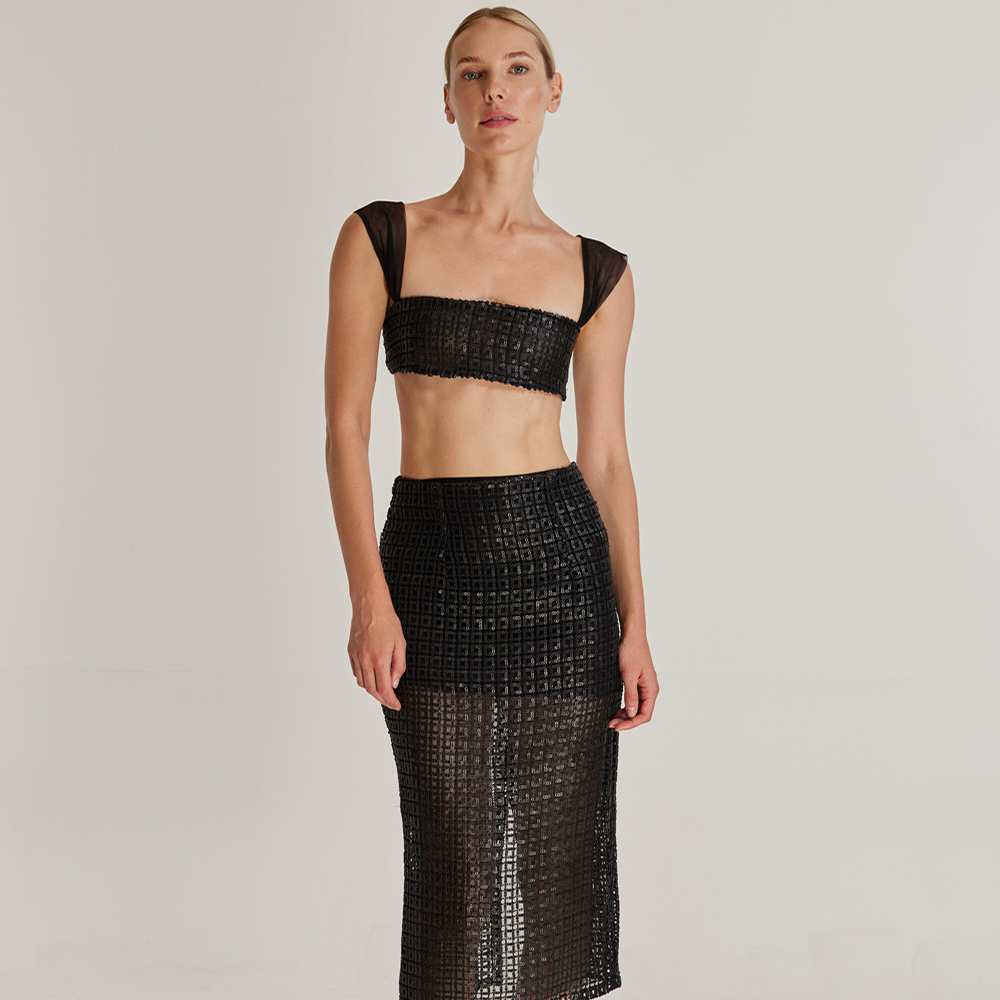 Introducing Solstice, our high-waisted pencil skirt and minimalistic bustier set. Crafted from matte sequin leather-textured fabric.