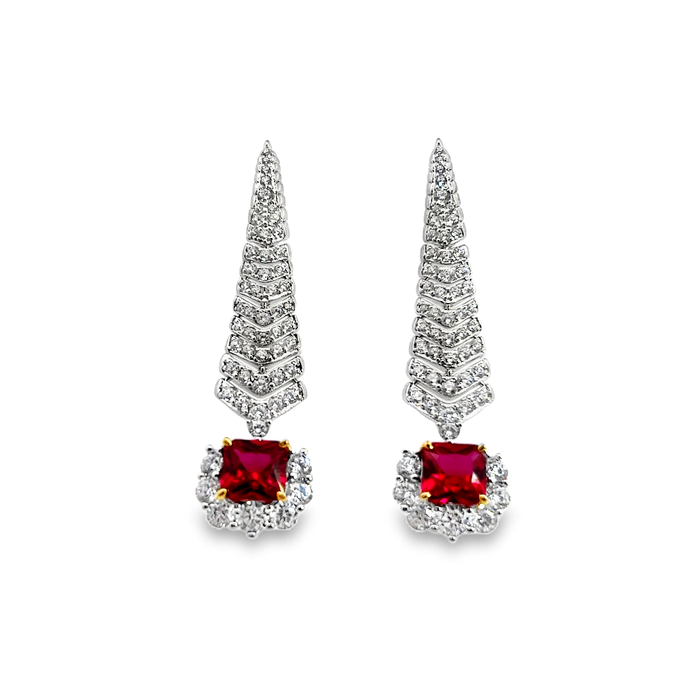 Shop online premium rhodium plated ruby shoulder duster earrings with sparkling cubic zirconia stones.