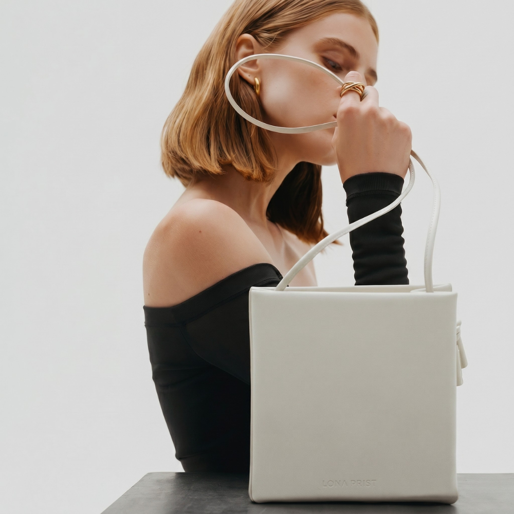 Premium leather bag with versatile handles and flap closure, pre order. Shop online from our curated edit of premium fashion.