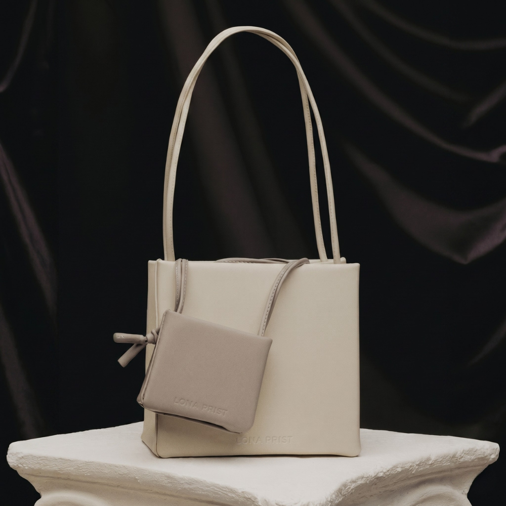 Premium leather bag with versatile handles and flap closure, pre order. Shop online from our curated edit of premium fashion.