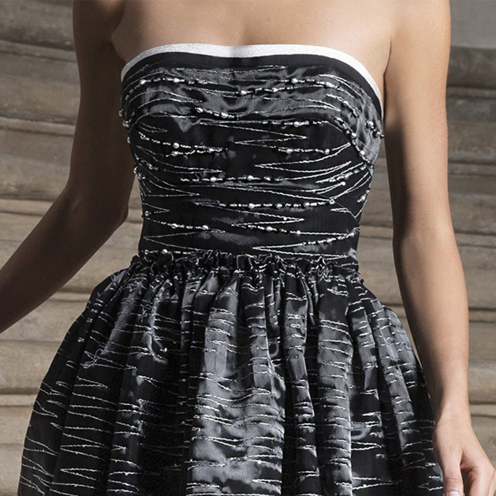 Dress in liquid organza embroidered with white thread and sequins all over this masterpiece.