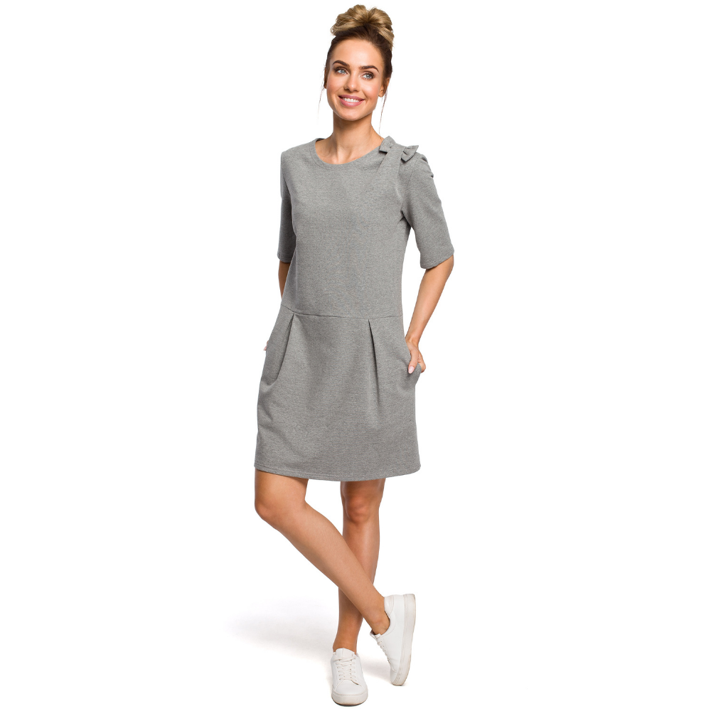 Sweat knit, dropped waist with short sleeves, decorative bow, above knee dress.